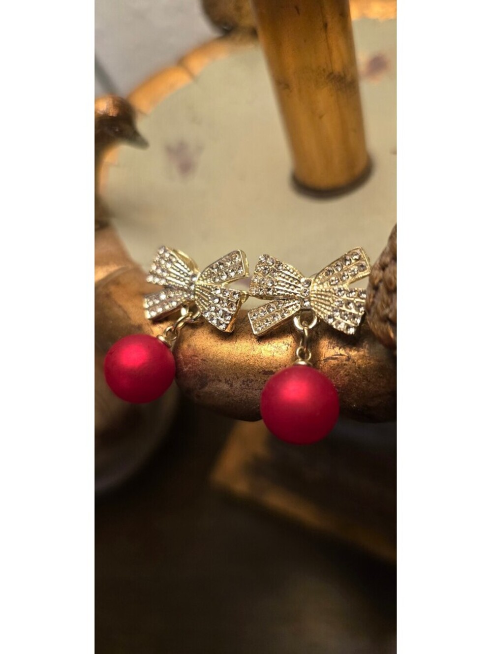 Elegant Gold Tone Bow Earrings with Red Bead Dangle